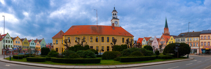 Panoramic view old market square with Town hall building in city Trzebiatow, Poland