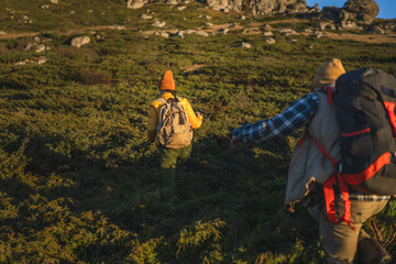 People hiking in mountain landscape enjoying trekking adventure