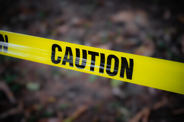 Yellow caution tape forest woods grounds outdoors warning danger barrier