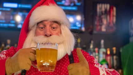 Santa Claus drinking beer at a bar. 