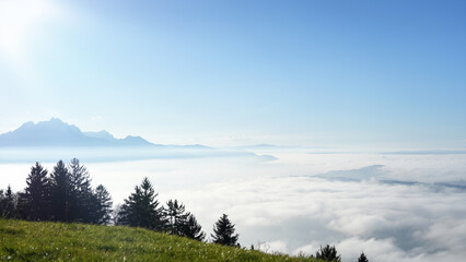 Majestic mountain view over clouds in early morning light capturing nature's tranquility