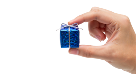 Hand holding a tiny wrapped present with a ribbon bow and copy space