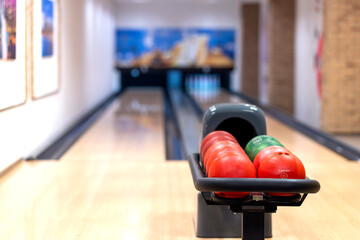 Bowling center with lanes and colorful bowling balls. Entertainment center. Board game