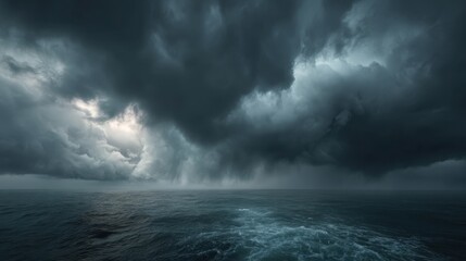 Dark storm clouds loom over the ocean water, creating a dramatic scene at dusk. The calm waves reflect the muted colors of the sky, hinting at an approaching storm.
