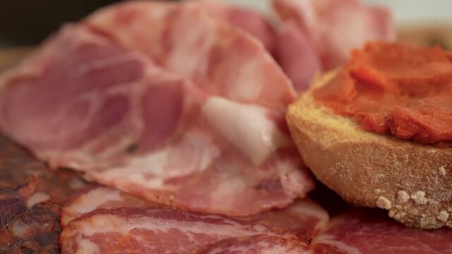 Traditional Italian charcuterie board with assorted cured meats and rustic presentation
