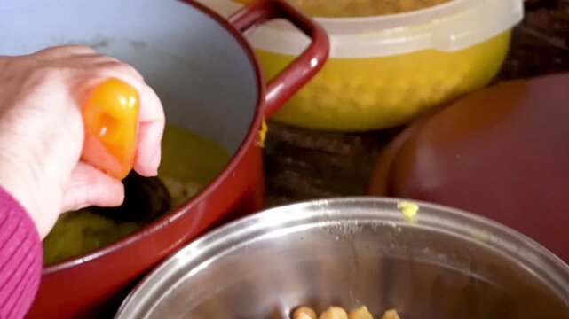 Slow motion, chickpeas stewed in a saucepan.