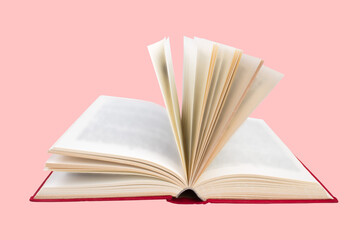 Open book isolated on pink background. Copy space for text.