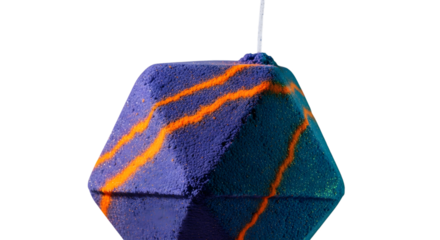 Hexagonal bath bomb with orange stripes isolated on transparent background