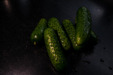 A few cucumbers and greens in close-up