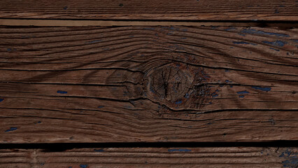 Naklejka premium Close-up of rustic wooden planks with chipped blue and red paint, weathered texture, grain patterns, and knots. Ideal for vintage backgrounds, design, or architectural mood boards.