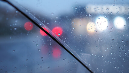 A transparent umbrella and a street out of focus, an autumn city in cloudy weather, melancholic bokeh