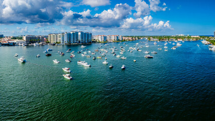 aerial drone view of Lake Boca Raton, Florida with boats and city