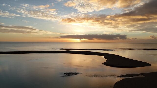Low swoop along beach