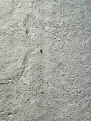 Tire tread mark on a concrete floor.