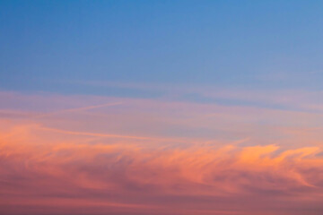 Pastel sky at sunset with soft clouds