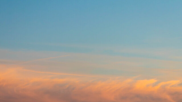Pastel sky at sunset with soft clouds