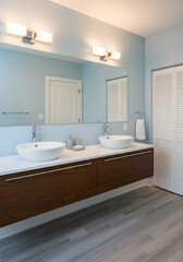 Fototapeta premium Modern double vanity bathroom with clean lines and natural light