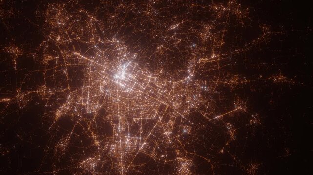 Turin (Italy) top view at night. Aerial view on modern city from space. Camera is flying above the city, moving forward. Vertical video. The north is on the left side
