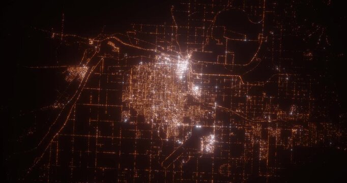 Yuma (Arizona, USA) aerial view at night. Top view on city from space. Camera is zooming in, rotating clockwise