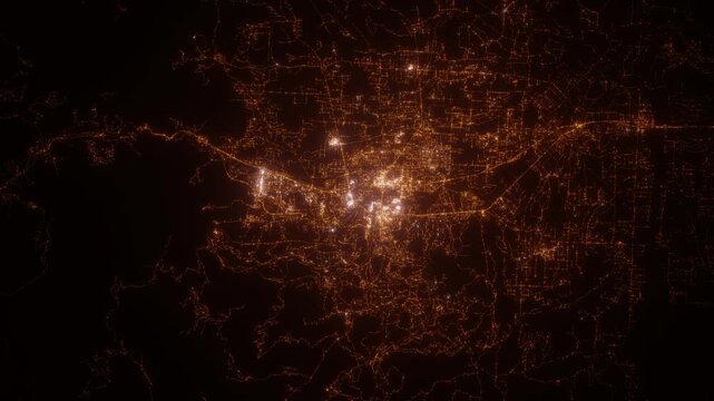Redding (California, USA) top view at night. Top view on modern city with street lights and glow effect. Camera is zooming in, rotating clockwise. Vertical video. The north is on the left side
