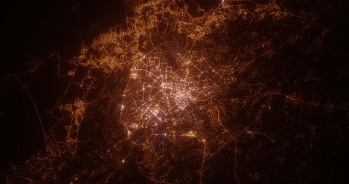 Tashkent (Uzbekistan) aerial view at night. Top view on city from space. Camera is zooming in, rotating clockwise