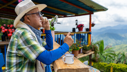Man coffee picker smoking on the farm