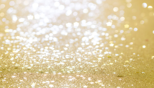 A vibrant, celebratory image featuring an abundance of golden stars and sparkling glitter against a bright, warm white and gold background. - Powered by Adobe