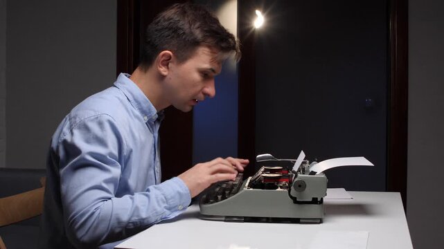 Man focusing on an old manual typewriter, gesturing with his hand while contemplating ideas and developing new stories or creative content, emphasizing the process of generating written works