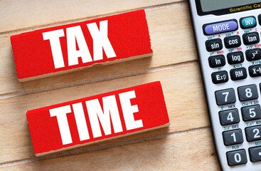 TAX TIME words on wooden blocks. Concept for business.