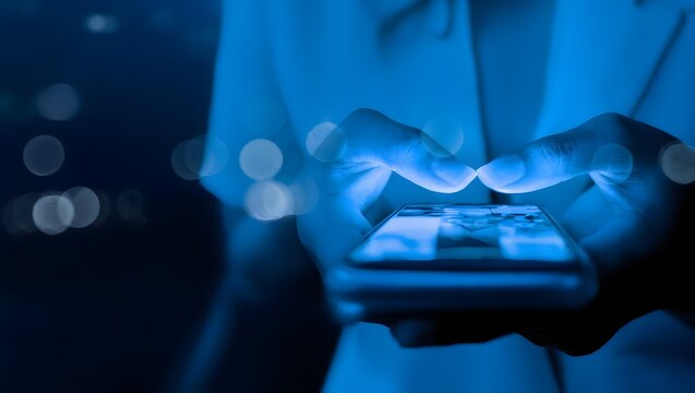 Finger of woman touching scroll page app on mobile phone.In a room with blue and purple neon tones.concept Social media and marketing