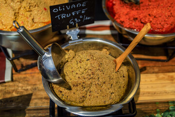 Olive and truffle tapenade at a farmers market stand in Old Town of Nice, France