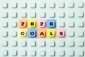 The phrase 2026 GOALS spelled out on a light blue studded board using colorful plastic letter tiles, symbolizing planning, resolutions, and future aspirations.
