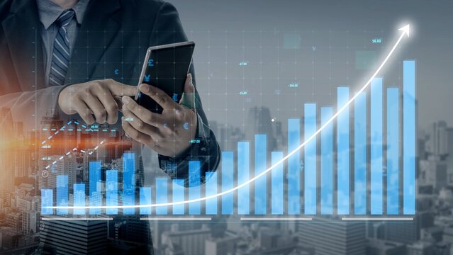 A businessman interacts with his smartphone, analyzing financial data displayed against a backdrop of a growing graph and a city skyline. The image reflects modern technology in business. Copula - Powered by Adobe