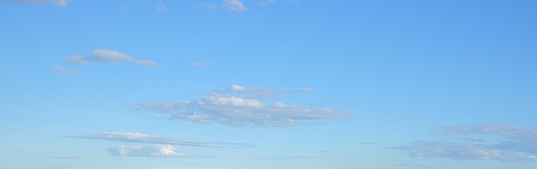 gradient pastel blue sky with clouds background