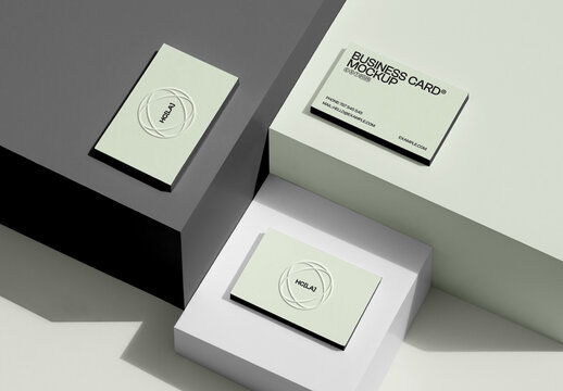 Three Lying on Boxes Business Card Mockups