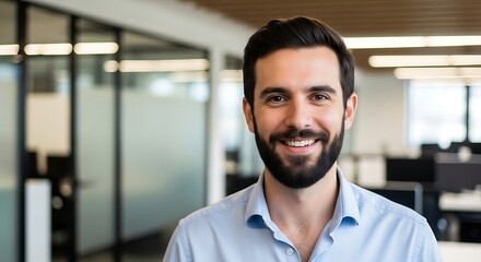 Confident Businessman Standing in Modern Office with Bright Open Workspace