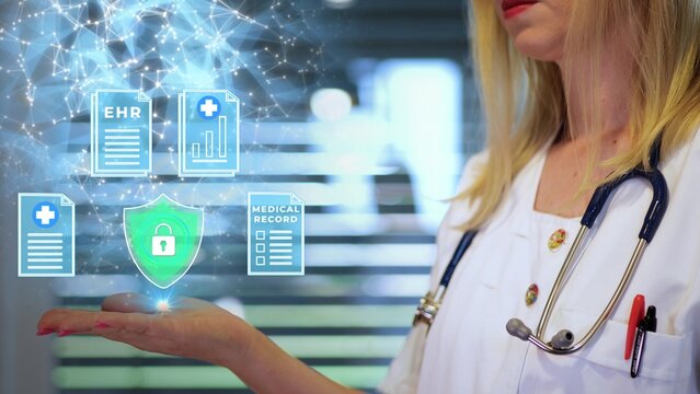 Cybersecurity concept with medical doctor showing shield icon and patient digital medical records