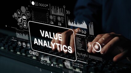 Hands Typing on Keyboard with Digital Value Analytics Display and Data Visualization Graphics in a...