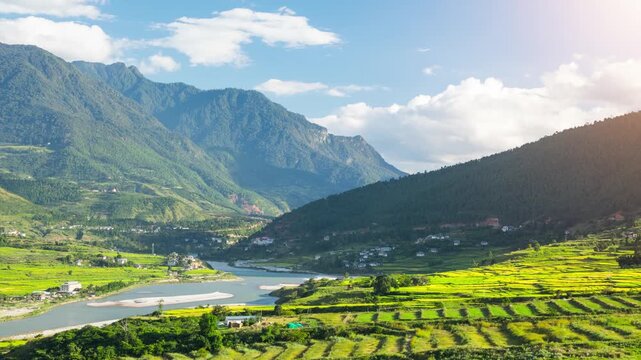 Time lapse of clouds moving over the rice paddies and the Punakha Valley in Bhutan.
