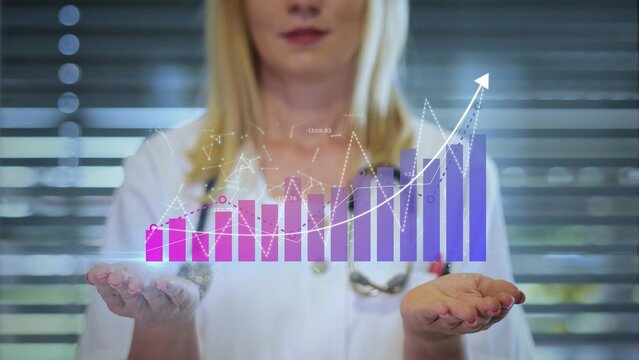 Doctor Holds A Holographic Graph Representing The Global Growth And Improvement Of Medical Healthcare Wealth - Powered by Adobe