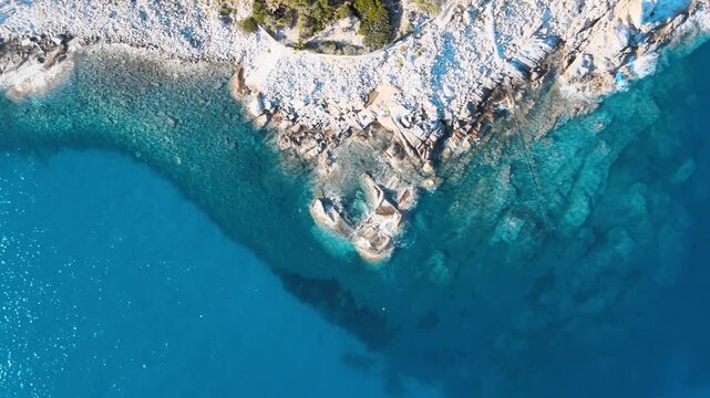 Rocks above the ocean, Italy. Elba Island in Tuscany, aerial view. Slow motion