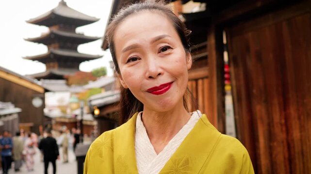 Elegant Japanese woman wearing a Kimono in the Nineizaka area of Kyoto Japan.