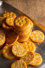 Round Crackers Snack.
A close-up photo of round crackers. Perfect for food, snack, bakery, or cooking-related projects.