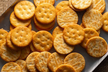 Round Crackers Snack.
A close-up photo of round crackers. Perfect for food, snack, bakery, or cooking-related projects.