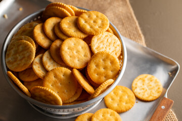 Round Crackers Snack.
A close-up photo of round crackers. Perfect for food, snack, bakery, or cooking-related projects.