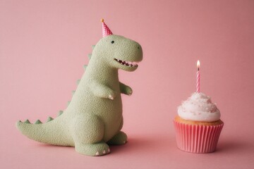 A cute dinosaur in a birthday hat stands beside a muffin with a candle that is lit, all on a simple background with room for text, suitable for greeting cards or invitations