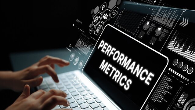Hands Typing on Laptop with Digital Performance Metrics Dashboard Displayed on Screen in Dark Environment. Asymptotic smart data analytic.