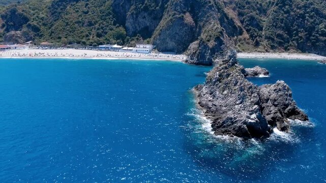 Aerial view of rock of the ulivarella, Tonnara di Palmi, Calabria, Italy. Slow motion