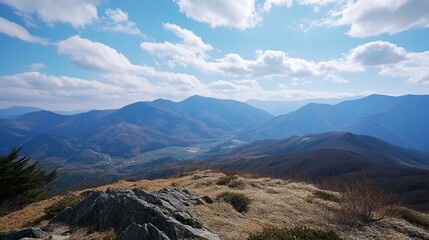 Mountain vista, sunlit peaks and valleys
