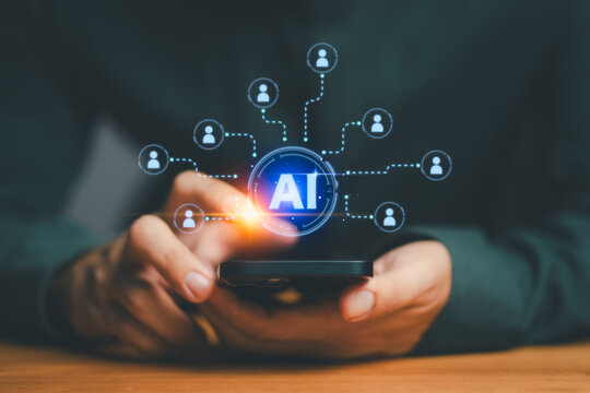 Artificial intelligence network connection concept showing person using smartphone with AI technology icon, symbolizing data innovation, digital transformation, and modern communication technology. - Powered by Adobe